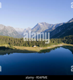 Alpine lake in Valtellina. Palù lake in Valmalenco. Aerial photo Stock Photo