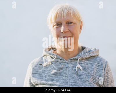Portrait of beautiful aged woman in the seashore. Selective soft focus on eyes. Stock Photo