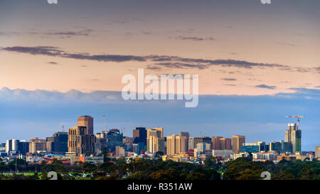 Adelaide night city skyline viewed from south-west towards north-east through parklands at dusk Stock Photo