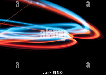 multicolor led light painting round trails abstract background on black Stock Photo