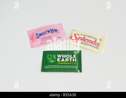 Three different packages of zero calorie artificial sweeteners: Sweet'N Low, Splenda, and Whole Earth (Stevia and Monk fruit) packets. Stock Photo