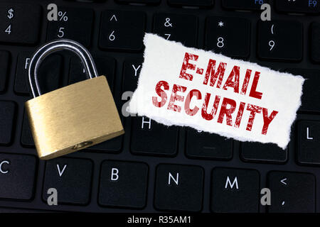 email security. Locked padlock on computer keyboard Stock Photo