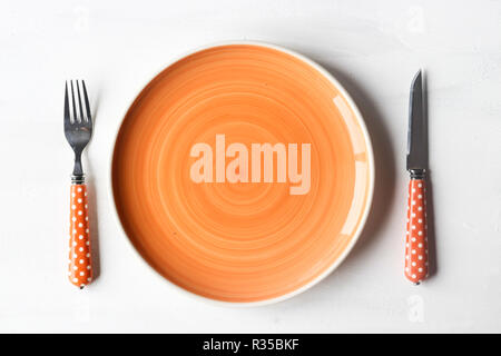 empty clean plate, fork and kinife Stock Photo