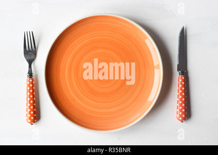 empty clean plate, fork and kinife Stock Photo