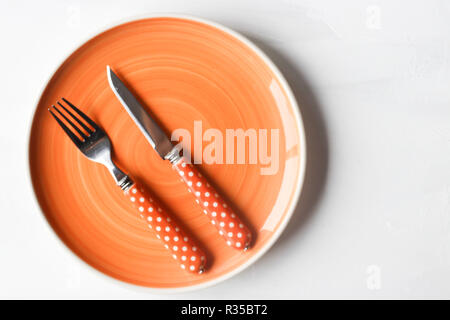 empty clean plate, fork and kinife Stock Photo