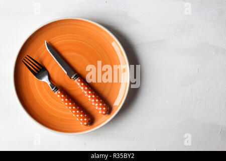 empty clean plate, fork and kinife Stock Photo
