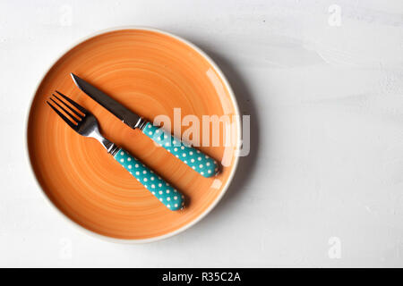 empty clean plate, fork and kinife Stock Photo