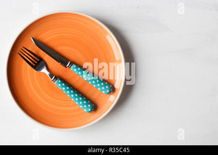 empty clean plate, fork and kinife Stock Photo