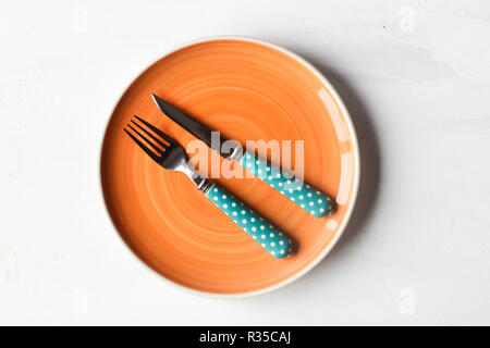 empty clean plate, fork and kinife Stock Photo