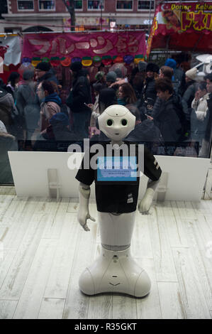 31.12.2017, Tokyo, Japan, Asia - A semi-humanoid robot of the Pepper series is seen in a shop window in the city ward of Shibuya. Stock Photo