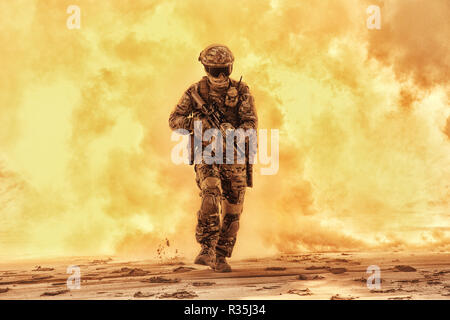 Army soldier in military camouflage uniform, helmet, with face hiding behind mask and glasses, running out from fire. Infantry rush with fire support, Stock Photo