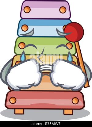 Crying colorful toy xylophone on mallets mascot Stock Vector