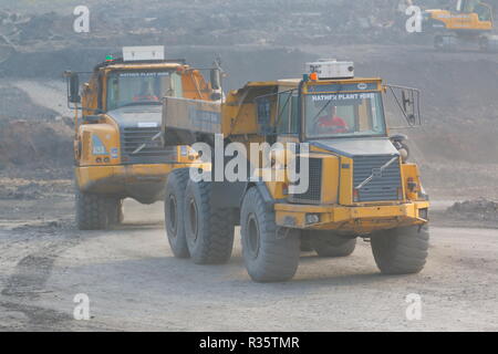 Articulated dumpers on the old Recycoal Coal Recycling Facility in Rossington,Doncaster which has ow been demolished to make way for a new houses. Stock Photo