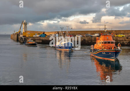 This is the Buckie based Fishing Boat, Ranger OB29 being towed back into Buckie Harbour on Tuesday 20 November 2018 by the Buckie Lifeboat. Stock Photo