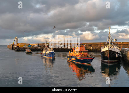 This is the Buckie based Fishing Boat, Ranger OB29 being towed back into Buckie Harbour on Tuesday 20 November 2018 by the Buckie Lifeboat. Stock Photo