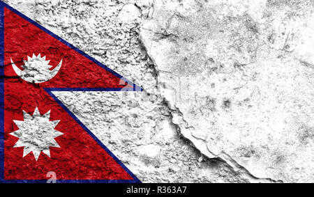 Flag of Nepal close up painted on a cracked wall, concept of armed actions and conflicts in the world Stock Photo