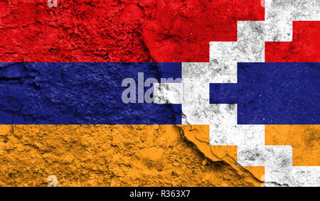 Flag of Nagorno-Karabakh Republic close up painted on a cracked wall, concept of armed actions and conflicts in the world Stock Photo