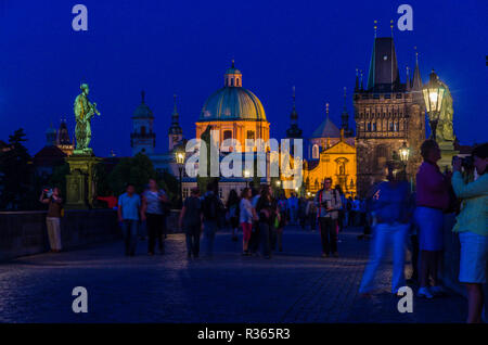 The St. Nicholas Orthodox Church at night, seen from the historic bridge 'Karlův most', the Charles Bridge Stock Photo