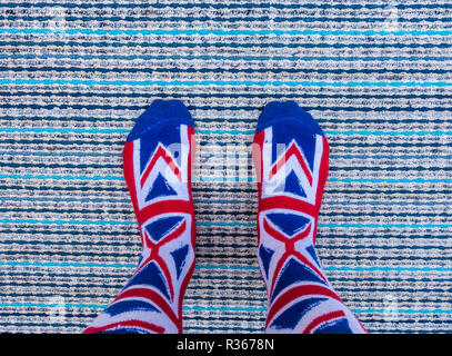 Union Jack socks on textured carpet background. Stock Photo