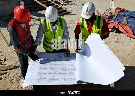 Skilled Engineers are doing daily Work Inspections to make sure the work has no problems Stock Photo