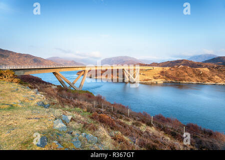 The Kylesku Bridge spanning Loch a' Chàirn Bhàin in Sutherland in the Highlands of Scotland Stock Photo