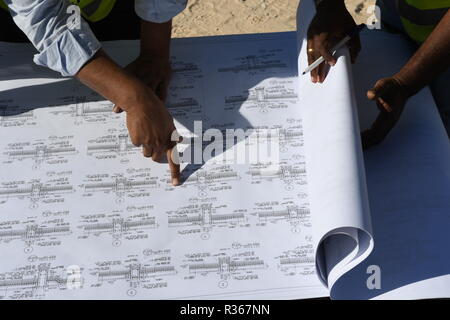 Skilled Engineers are doing daily Work Inspections to make sure the work has no problems Stock Photo