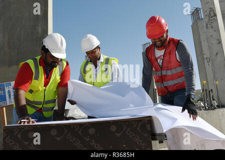 Skilled Engineers are doing daily Work Inspections to make sure the work has no problems Stock Photo