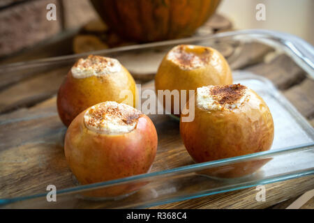 Thanksgiving dessert menu. Fall harvest. Autumn menu. Stuffed apples. Apples stuffed with cottage cheese and cinnamon. Ready to eat. Stock Photo