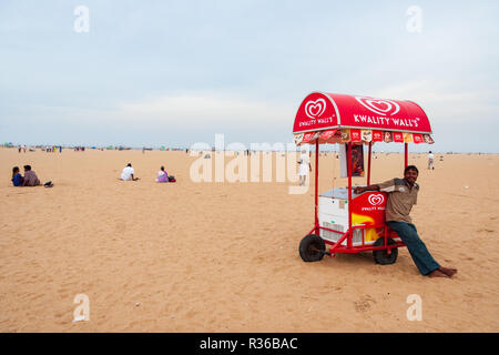 Chennai, India - September 6, 2007: A young man selling ice-cream on Marina beach in Chennai. Stock Photo