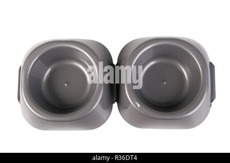 Two gray plastic cat food bowls isolated on white, top view Stock Photo