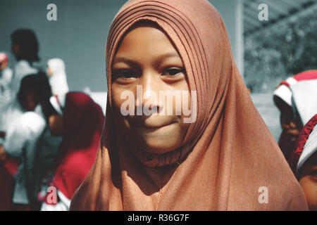 An Indonesian girl wears a veil Stock Photo