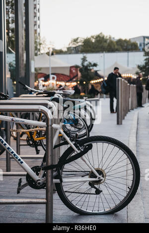 London, UK - November 02, 2018: A row of bikes parked on the street in London. Cycling is a popular way to commute in the city.