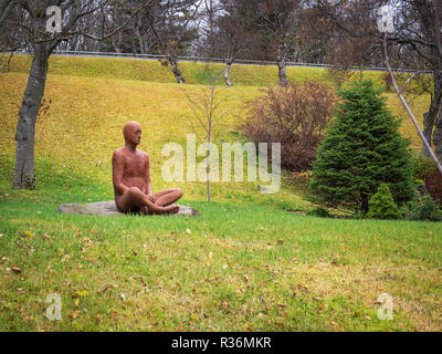 REYKJAVIK, ICELAND-OCTOBER 23, 2018: Statue of a meditating man in the lotus position Stock Photo