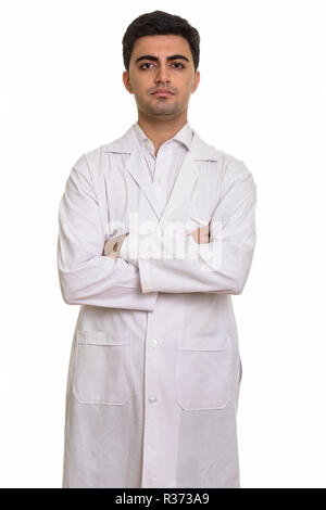 Young handsome Persian man doctor with arms crossed Stock Photo