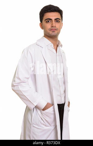Young handsome Persian man doctor looking at camera Stock Photo