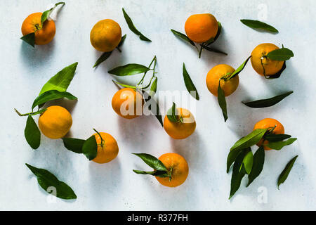 Christmas pattern. Christmas tangerines on white background. Flat lay, top view Stock Photo