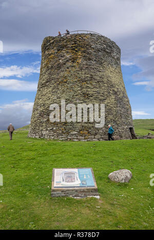 Elderly tourists visiting Mousa Broch, tallest Iron Age broch and one of Europe's best-preserved prehistoric buildings, Shetland Islands, Scotland, UK Stock Photo