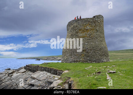 Tourists visiting Mousa Broch, tallest Iron Age broch and one of Europe's best-preserved prehistoric buildings, Shetland Islands, Scotland, UK Stock Photo