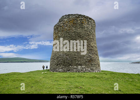 Elderly tourists visiting Mousa Broch, tallest Iron Age broch and one of Europe's best-preserved prehistoric buildings, Shetland Islands, Scotland, UK Stock Photo