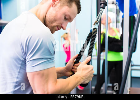man working out at the gym Stock Photo