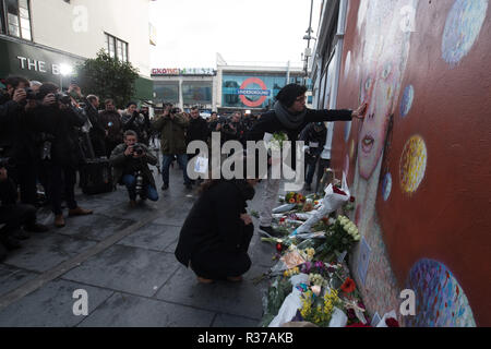 Tunstall Road, London, UK. 11th January, 2016. London, UK. Mourners lay flowers at  the foot of the David Bowie mural in Brixton. Stock Photo
