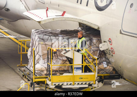 LONDON HEATHROW AIRPORT - JUNE 2018: Close up of an air freight pallet being loaded into the cargo hold of a Virgin Atlantic Airbus A330 at London Stock Photo