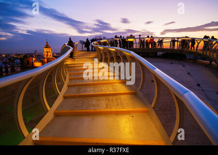 Seville, Spain - November 13, 2018: Metropol Parasol with unidentified people at night. It is a wooden structure designed by Juergen Mayer, with dimen Stock Photo