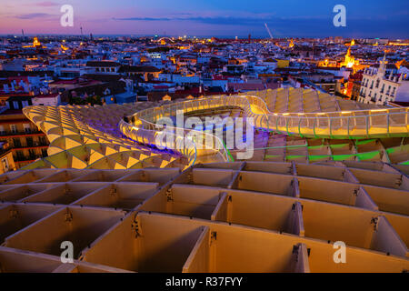 Seville, Spain - November 13, 2018: Metropol Parasol with unidentified people at night. It is a wooden structure designed by Juergen Mayer, with dimen Stock Photo