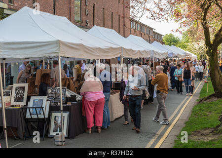 Shoppers visiting the outdoor artisan market in Wilmslow Cheshire,  The market takes place in the town centre.  A sunny spring day Stock Photo