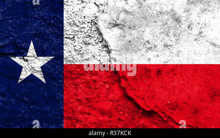 Flag State of Texas close up painted on a cracked wall, concept of armed actions and conflicts in the world Stock Photo