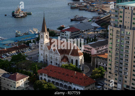 TANZANIA Daressalaam, bay and seaport, in front catholic St. Joseph cathedral, built during german colonial time, and passenger ferry terminal Stock Photo