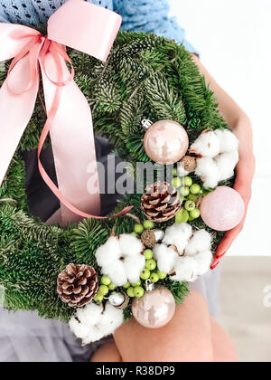 Young woman holding a Christmas wreath Stock Photo