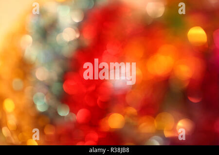 Multi colored Christmas lights at night. Beautiful blurred background. Stock Photo