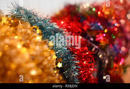 Multi colored Christmas garlands with beautiful blurred background. Stock Photo